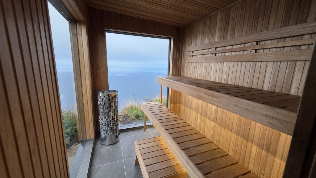 Glass-fronted sauna in Northern Ireland overlooking the Atlantic Ocean