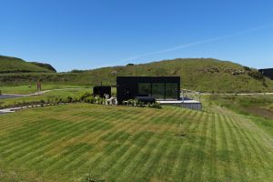 Luxury timber-clad cabin with private hot tub and outdoor decking at Carrick-a-Rede Retreat near Ballintoy, Northern Ireland