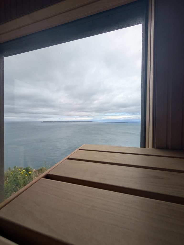 Interior of a luxury coastal sauna in Northern Ireland overlooking the Atlantic Ocean.